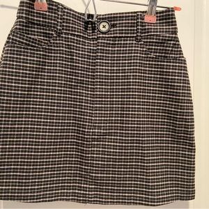 Black and gray skirt. Plaid , light flannel material . Size xs . Euc